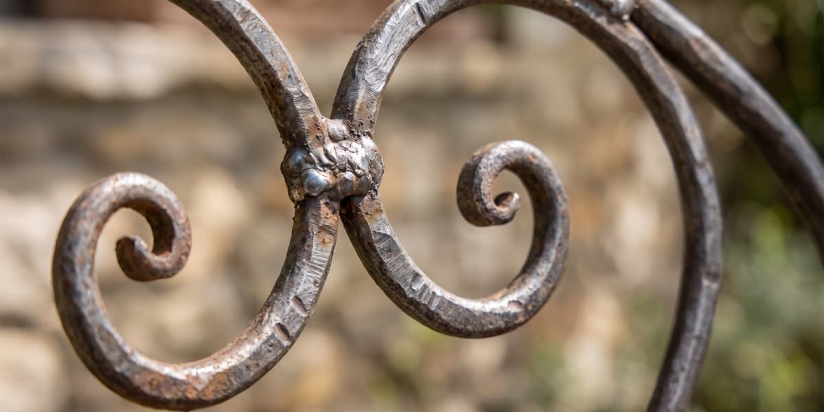wrought-iron-scrollwork-detail-outdoor-chair